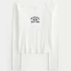 Lace Trim Off-the-Shoulder Montauk Graphic Tee,Lace Trim Off-the-Shoulder Montauk Graphic Tee Lace Trim Off-the-Shoulder Montauk Graphic Tee,Lace Trim Off-the-Shoulder Montauk Graphic Tee